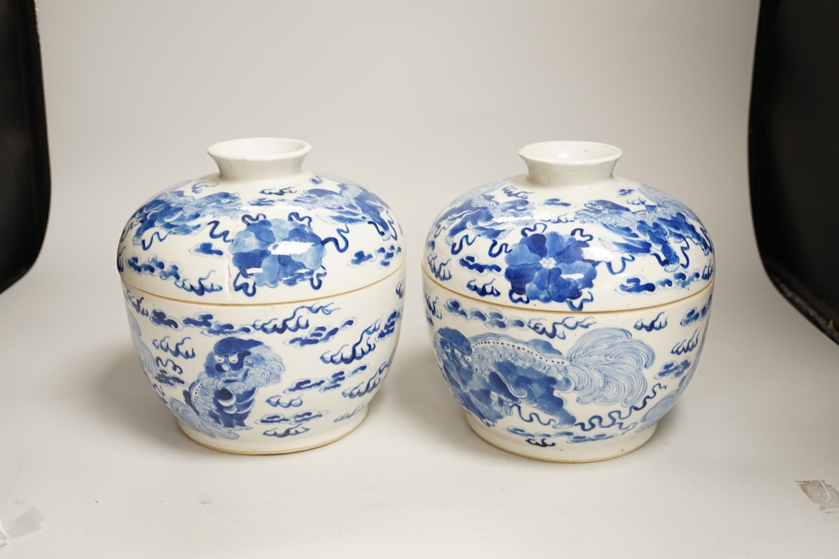 A pair of Chinese blue and white 'Buddhist lion' bowls and covers, chupu, probably made for the Straits market, late 19th century, 20cm high